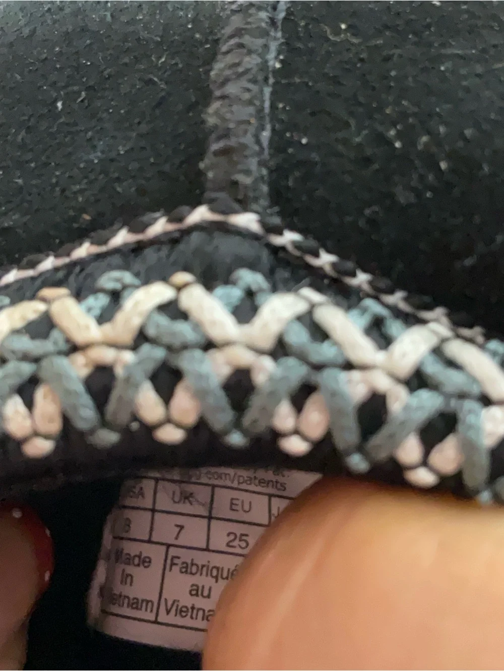 Kids Black Cozy Slip-On Shoes with Decorative Trim It is torn to shreds—heaps of